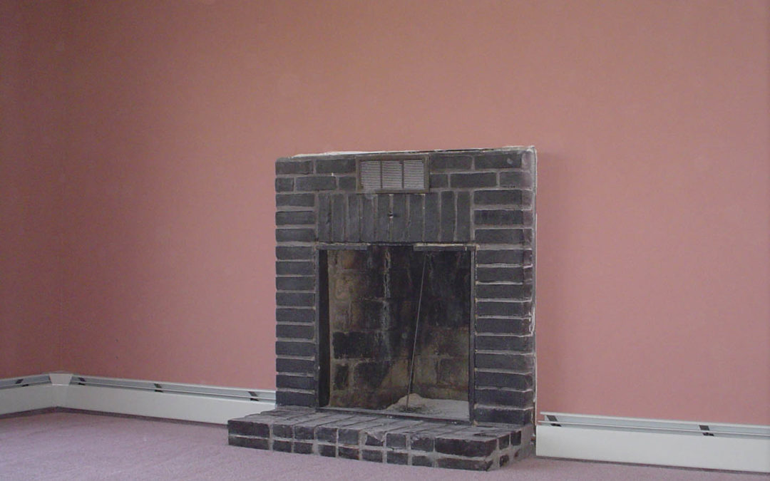 brick fireplace with lots of smoke stains