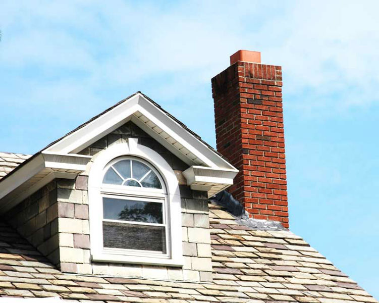 Dormer on roof beside chimney.  We also repair smoke and draft problems.